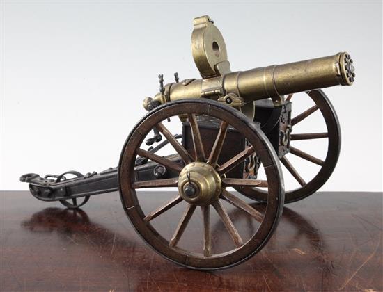A brass and painted steel working model of an 1883 gatling gun, 14in.